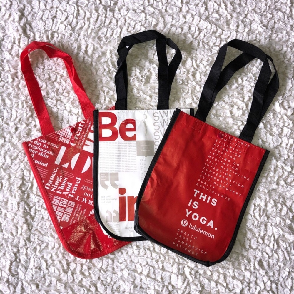Three Lululemon reusable tote shopping bags